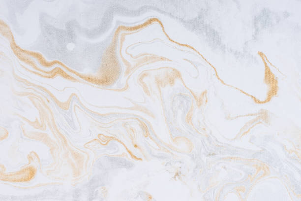 istock White paper sheet texture background. Flowing colors. Golden and silver fluid color pattern. 954912844