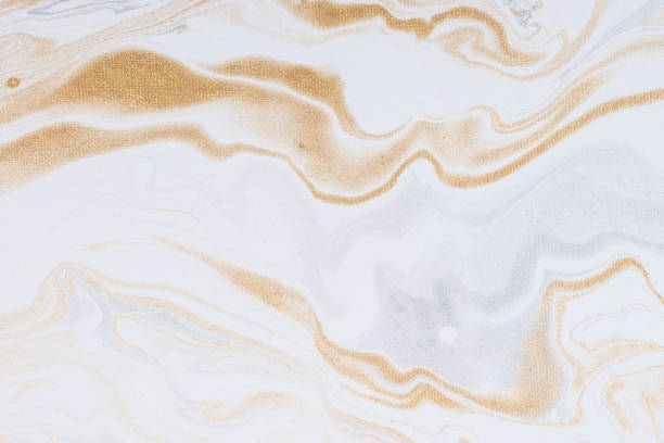 istock White paper sheet texture background. Flowing colors. Golden and silver fluid color pattern. 954912868