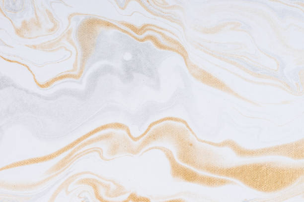 istock White paper sheet texture background. Flowing colors. Golden and silver fluid color pattern. 954912890