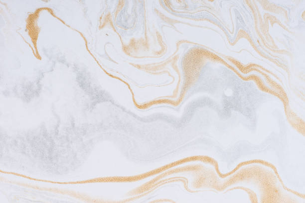 White paper sheet texture background. Flowing colors. Golden and silver fluid color pattern.