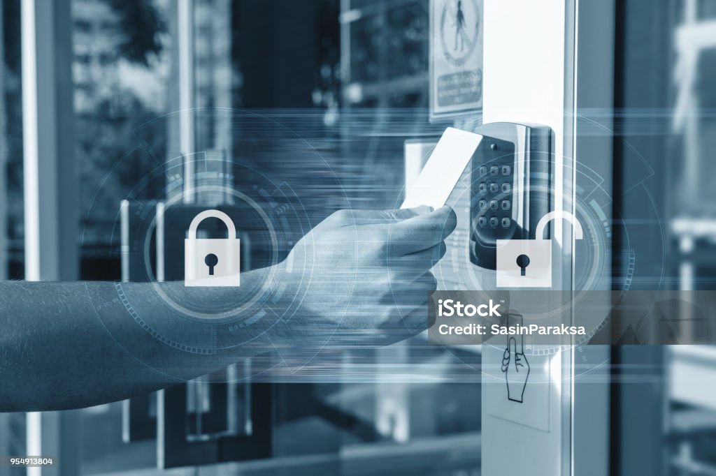 Hand using security key card unlocking the door to entering private building . Home and building security system Security Stock Photo