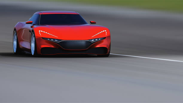 istock red car driving on a road 954918442