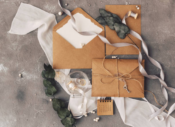 istock Wedding concept. Invitation on a grey background with decorations. Top view, flat lay. Mock up 954922710