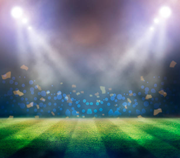 istock lights at night and football stadium 3D 954923822