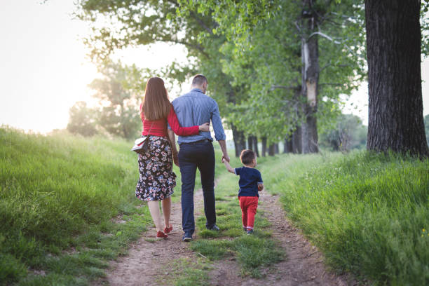 istock Young family walking in nature 954924766