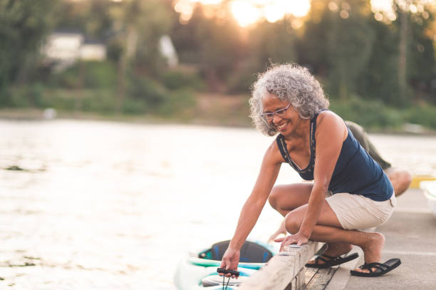 istock A beautiful older woman prepares to go kayaking 954927552