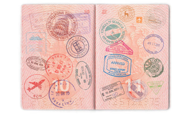 istock Visas, stamps, seals in the passport. Background with various countries 954928144