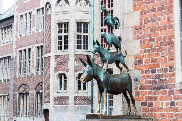 Bremen, Germany Bremen, Germany. Bronze statue by Gerhard Marcks depicting the Bremen Town Musicians, erected in 1953 ass horse family photos stock pictures, royalty-free photos & images
