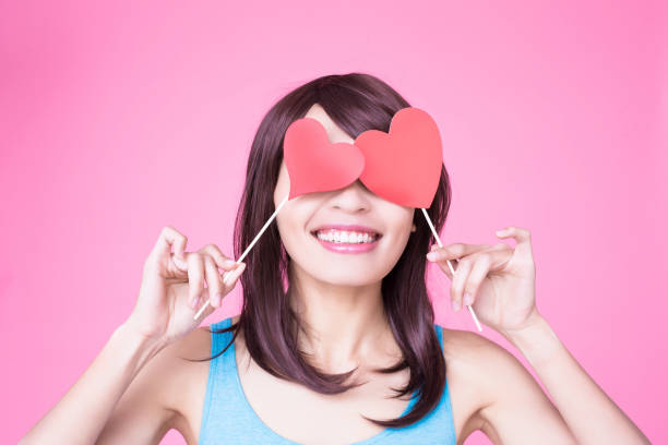 istock woman holding red love heart 954932166