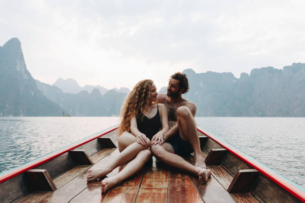 istock Couple boating on a quiet lake 954936340