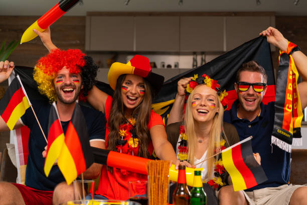 istock four happy german soccer fans 954936990