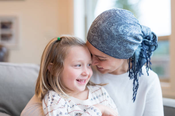 istock Young mom with cancer holds her daughter 954939864