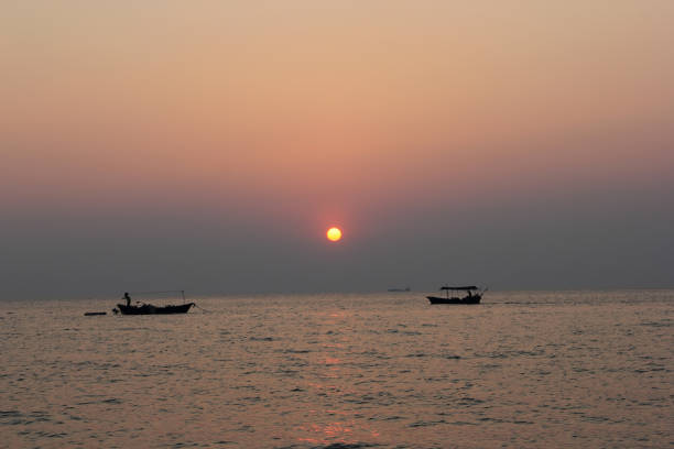 istock Sunrise and sunset on the sea and boat. 954940414