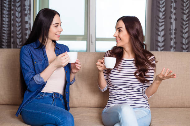 istock Two women with cups of coffee 954941604