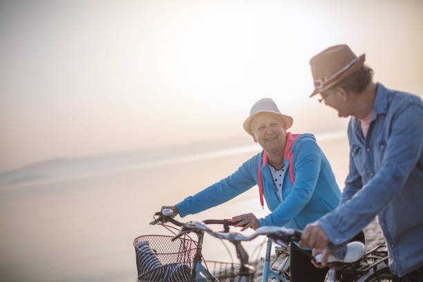 istock Active seniors couple with bike 954941666