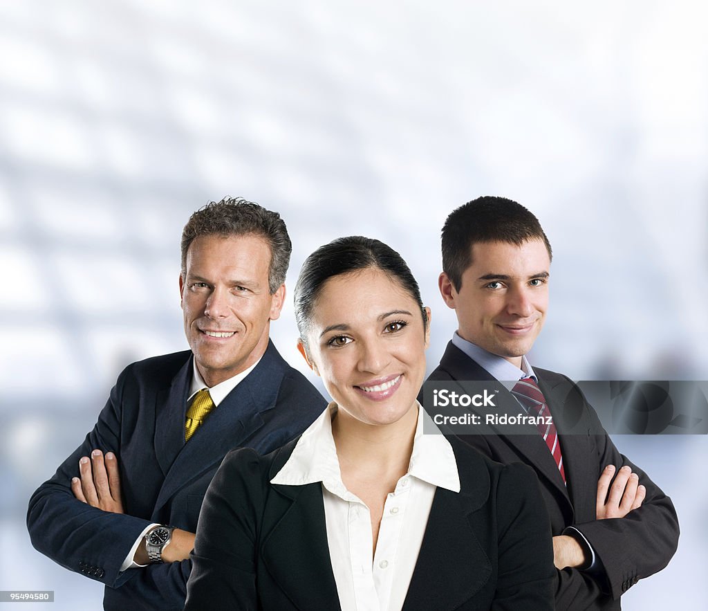 Smiling business team in office Multi aged happy business team with woman and men in a modern office with copy space. Adult Stock Photo