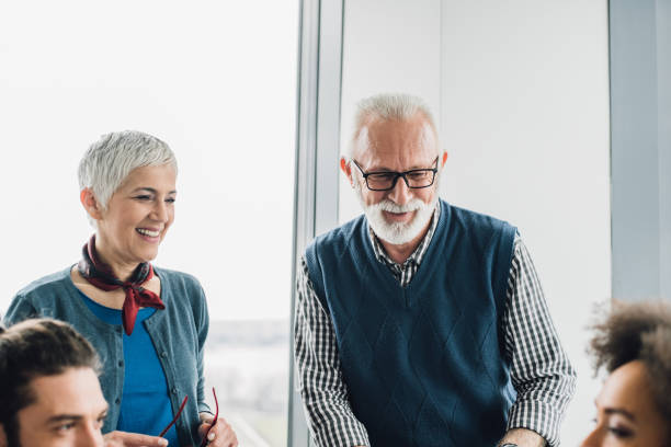 istock Senior coworkers at office 954956914