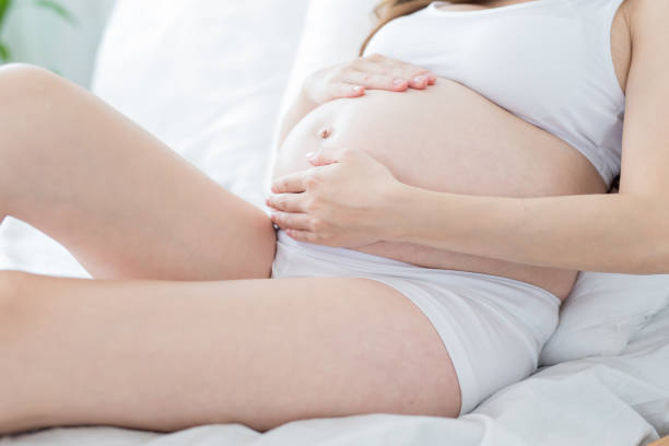 istock close up pregnant women belly 954957882