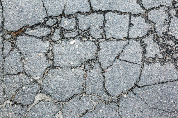 istock A dark crack on the background of a rocky surface. 954961350