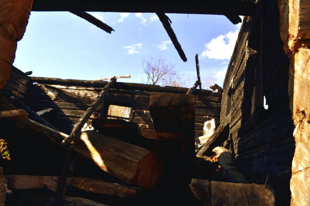 istock burnt-out wooden house 954962136
