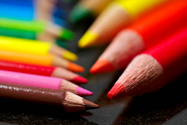 Colored pencils, large and small stock photo