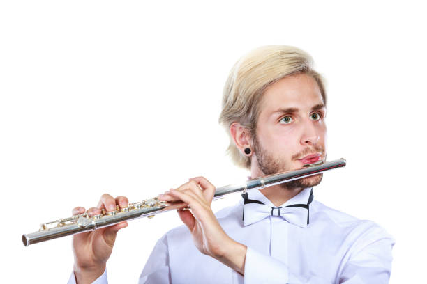 istock Male flutist playing his flute 954965786