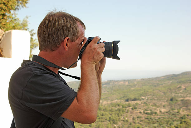 istock Man Taking A Photograph on Vacation. Horizontal stock photo. 95496593