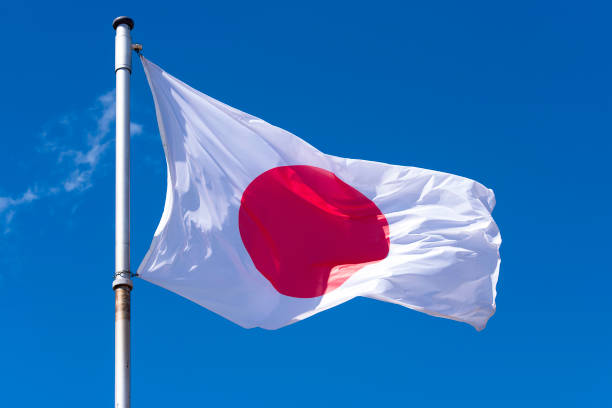 istock Flag of Japan against blue sky 954966732