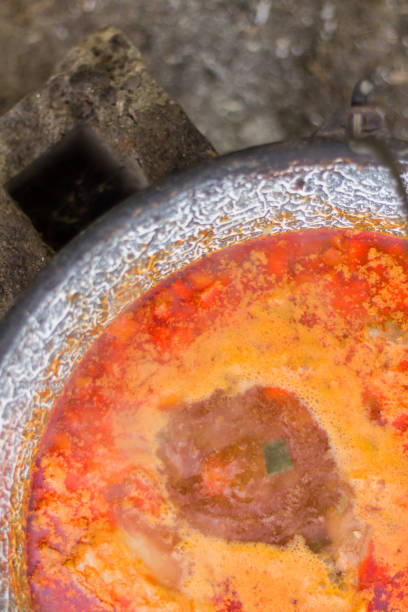 Gulyas stew boiling in a cauldron