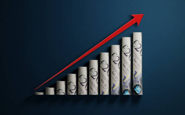 Financial Growth Bars Textured With Twenty British Pound Notes On Dark Blue Background A red arrow and financial growth bars textured with Twenty British pound notes on dark blue background. Growth concept. Horizontal composition with selective focus and copy space. british currency stock pictures, royalty-free photos & images