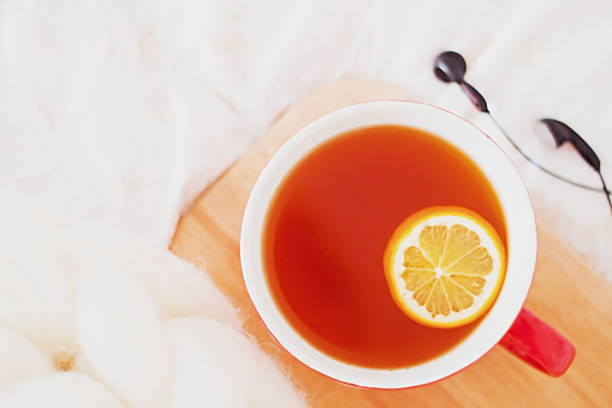 istock Having a cup of tea in bed - cozy breakfest at home 954972212