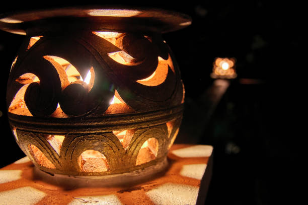 istock Decorative street lamp glowing at night. Close-up. Dark background. 954972570