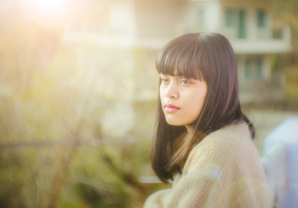 istock Young woman thinking in balcony. 954972818