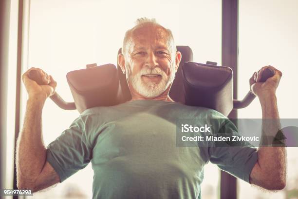 Hard Exercise Stock Photo - Download Image Now - Exercise Machine, Senior Adult, Exercising