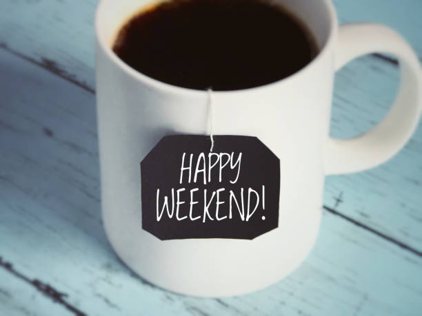 Motivational and inspirational greeting. ‘Happy weekend!’ written on a black piece of paper. With blurred vintage styled. saturday stock pictures, royalty-free photos & images