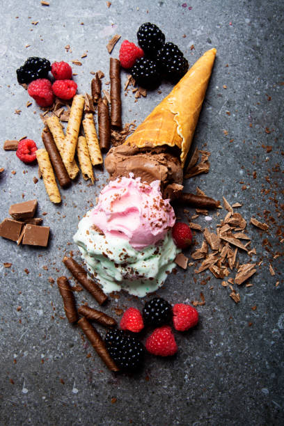 istock Ice cream cone with berries, chocolate and wafers 954982306