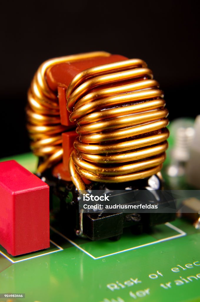 Common mode choke electronic component close up Electronic component for common mode noise filtering Choking Stock Photo