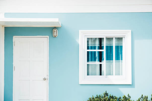 istock Front of resort with door and window on green background 954986946