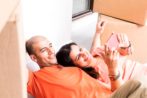 istock young couple moving to new house 954992054