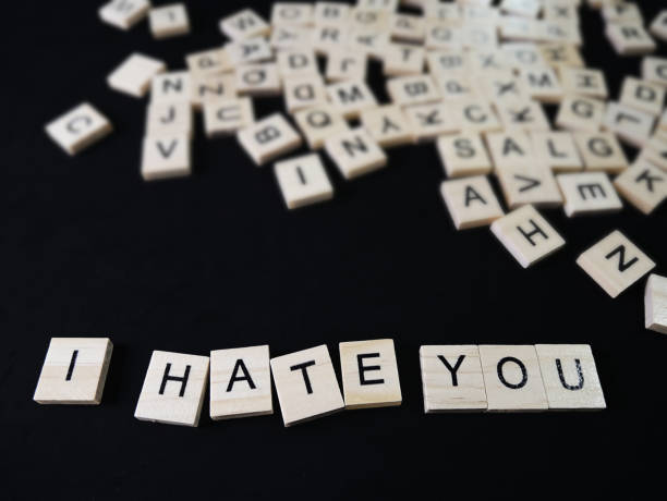 istock words hate text on wooden blocks on black background 954992278