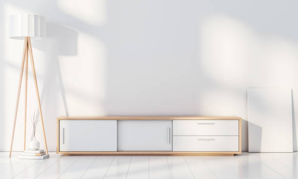 istock Modern interior wall mockup with console for smart Tv, Poster frame stand, blank canvas on the floor 954996304