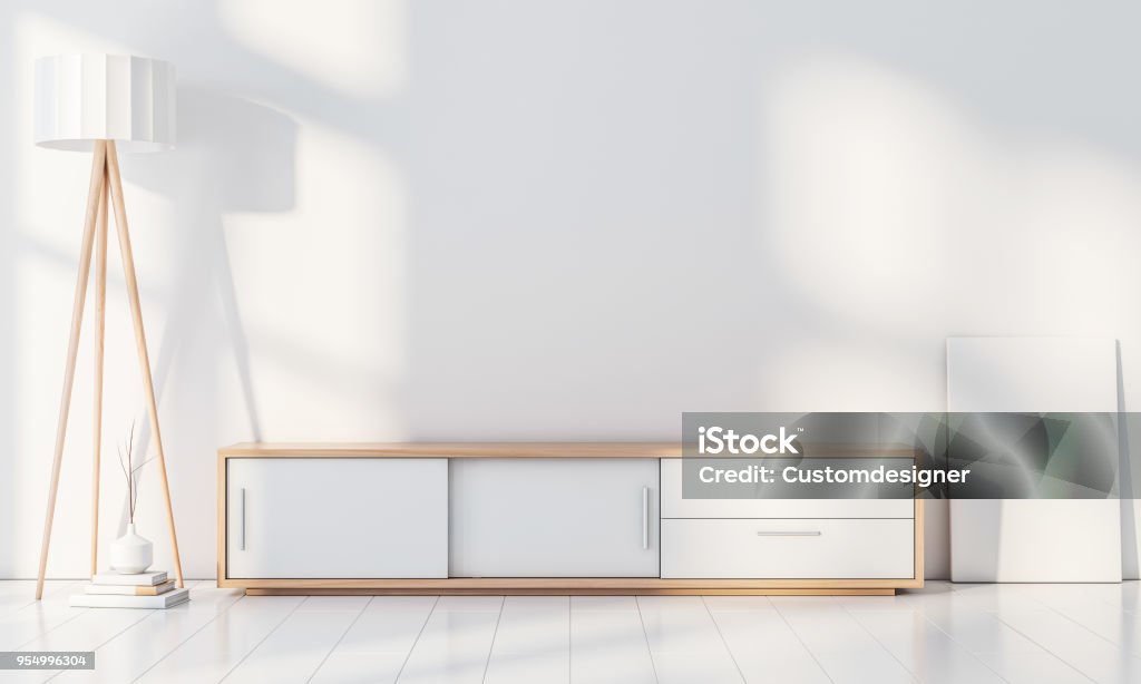Modern interior wall mockup with console for smart Tv, Poster frame stand, blank canvas on the floor Modern interior wall mockup with console for smart Tv, Poster frame stand, blank canvas on the floor, 3d rendering Living Room Stock Photo
