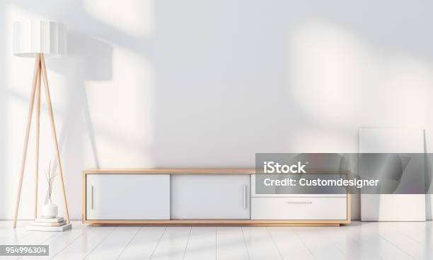 Modern Interior Wall Mockup With Console For Smart Tv Poster Frame Stand Blank Canvas On The Floor Stock Photo - Download Image Now
