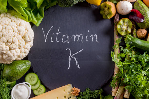 istock Green vegetables rich in vitamin K on black slate. 954997908
