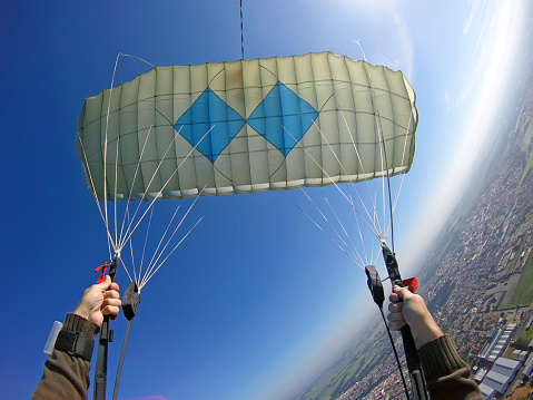 piloting his parachute