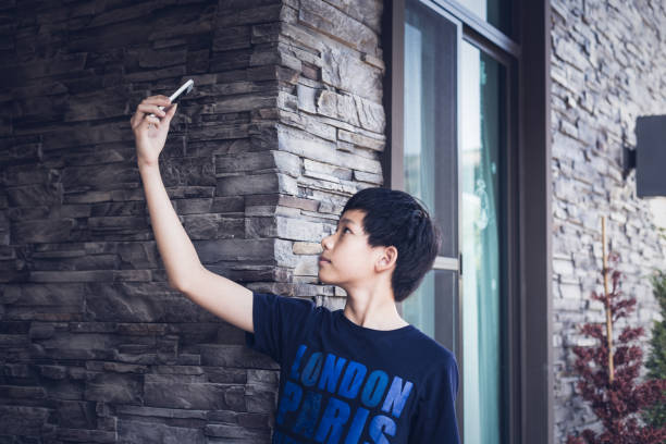 istock Asian teenager using mobile phone take photo selfie. 955005122