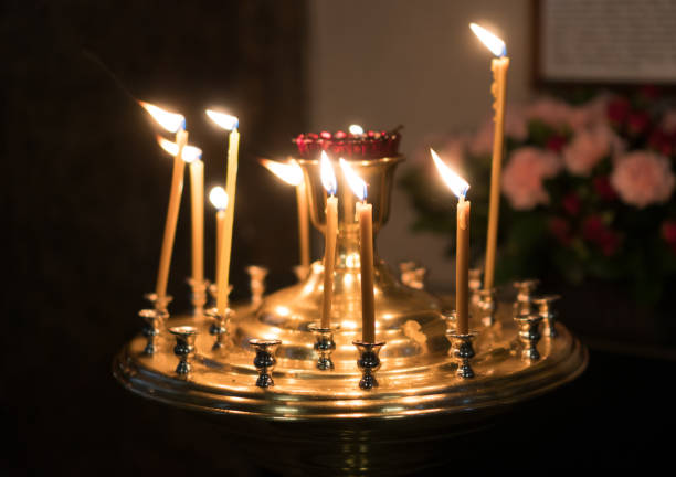 istock Metal candle light cresset in church. 955007902