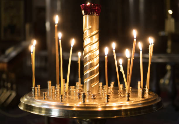 istock Metal candle light cresset in church. 955007918