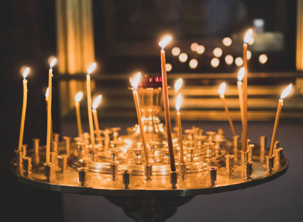 istock Metal candle light cresset in church. 955007936