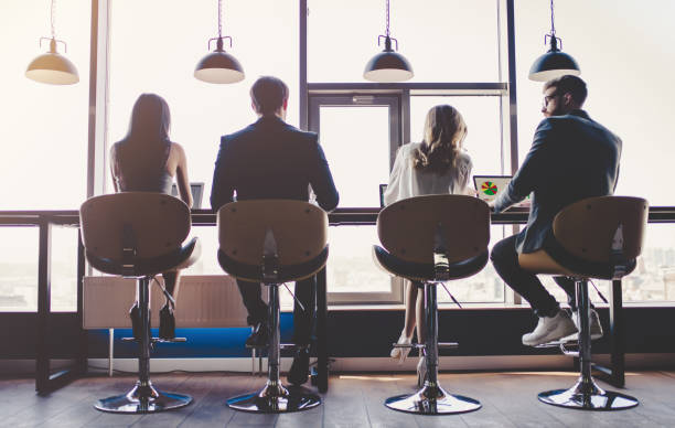 istock Group of people working in modern office 955010292
